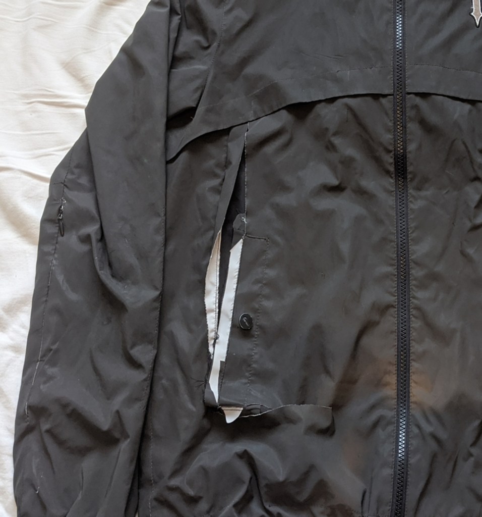 Large rip on reflective Jacket | Bobbins for Dobbins